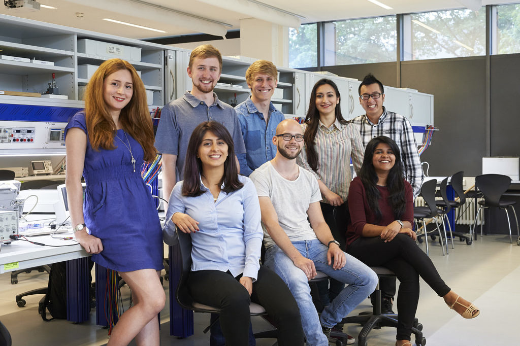 Group of students in a lab, smiling
